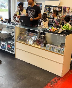 The Zombie X Games trade counter with staff helping customers